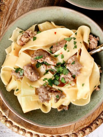 20 Minute Sausage Carbonara on a green plate.