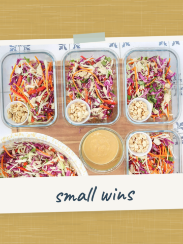 Meal prep salads in containers with peanut sauce