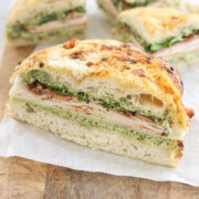 Turkey bacon pesto focaccia sandwich with provolone, arugula, and homemade pesto mayo.