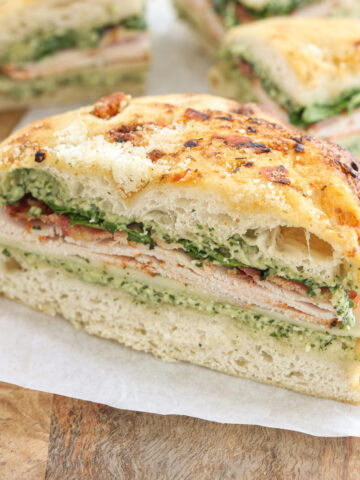 Turkey bacon pesto focaccia sandwich with provolone, arugula, and homemade pesto mayo.