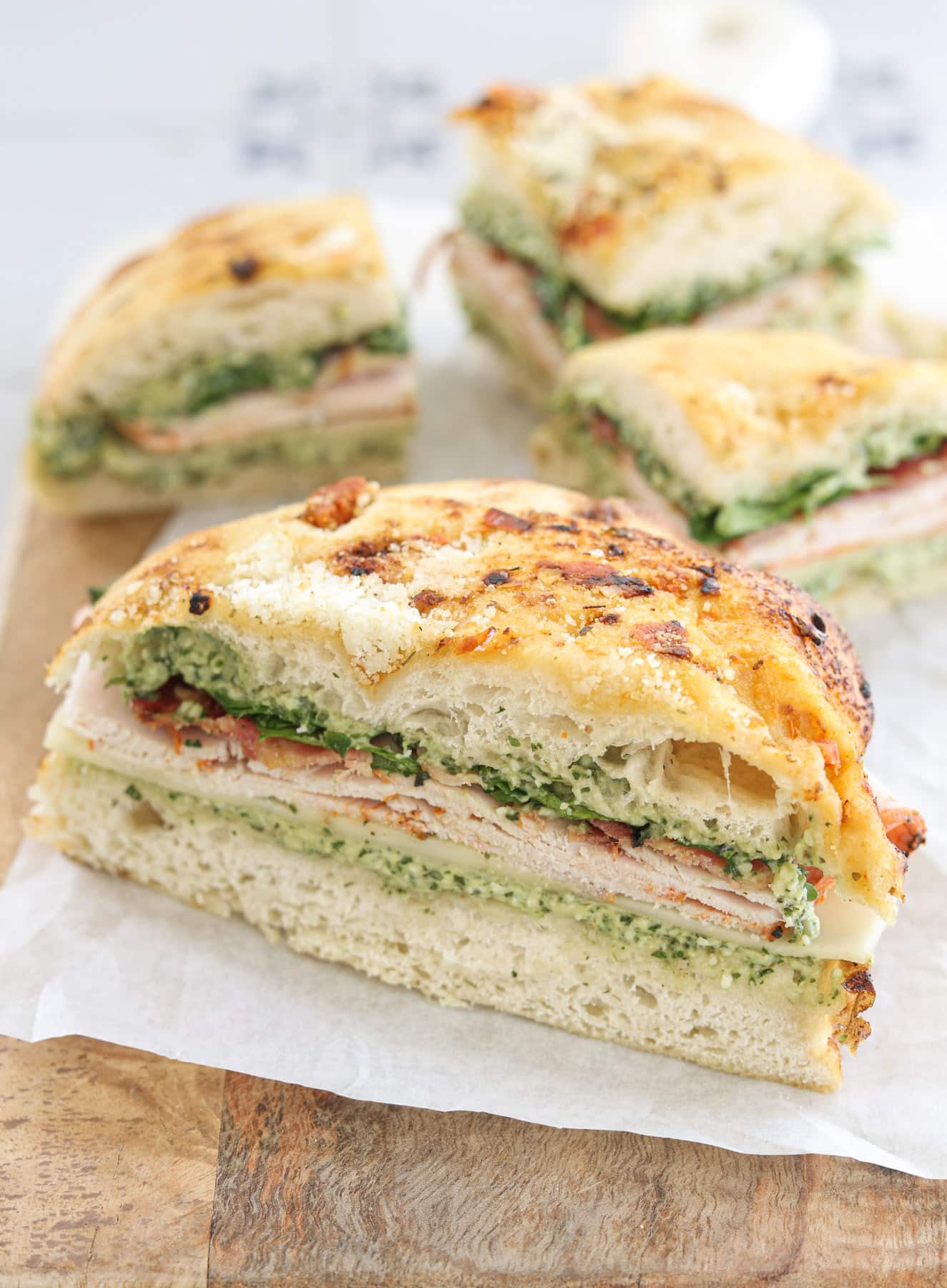 Turkey bacon pesto focaccia sandwich with provolone, arugula, and homemade pesto mayo.