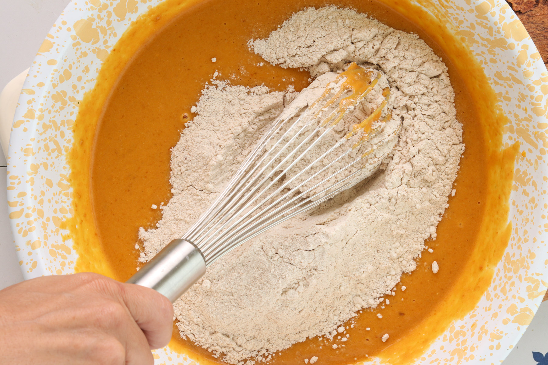 Mix the dry ingredients. Whisk together the flour, protein powder, baking powder, baking soda, cinnamon, pumpkin pie spice and salt in a medium bowl.